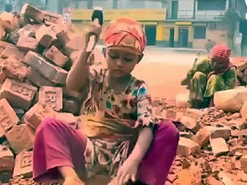 Enslaved children who make hard core from bricks